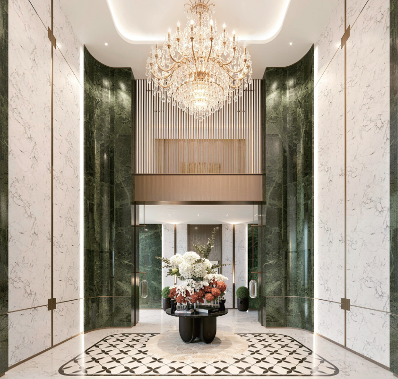 Avana Oasis Apartments grand reception lobby with crystal chandelier, marble wall finishes, decorative flooring and elegant entrance.