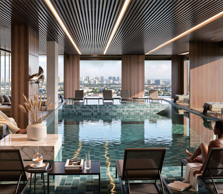 Avana Oasis Apartments heated infinity swimming pool with luxury poolside lounges, panoramic city views and elegant indoor design.