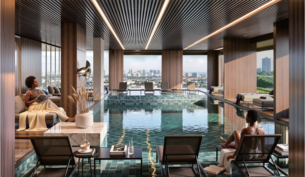 Avana Oasis Apartments heated infinity swimming pool with luxury poolside lounges, panoramic city views and elegant indoor design.
