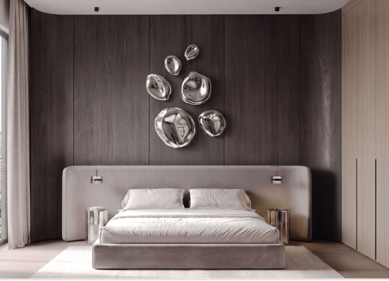 Belmont Residence modern apartment bedroom in Kilimani featuring a spacious upholstered bed, dark wood accent wall, metallic wall decorations, pendant lights, and fitted wardrobes.
