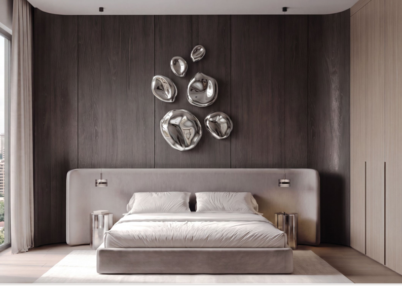 Belmont Residence modern apartment bedroom in Kilimani featuring a spacious upholstered bed, dark wood accent wall, metallic wall decorations, pendant lights, and fitted wardrobes.