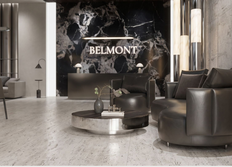 Belmont Residence co-working space rendering featuring elegant lounge chairs, a black marble reception feature wall, modern work tables, and sophisticated interior lighting.