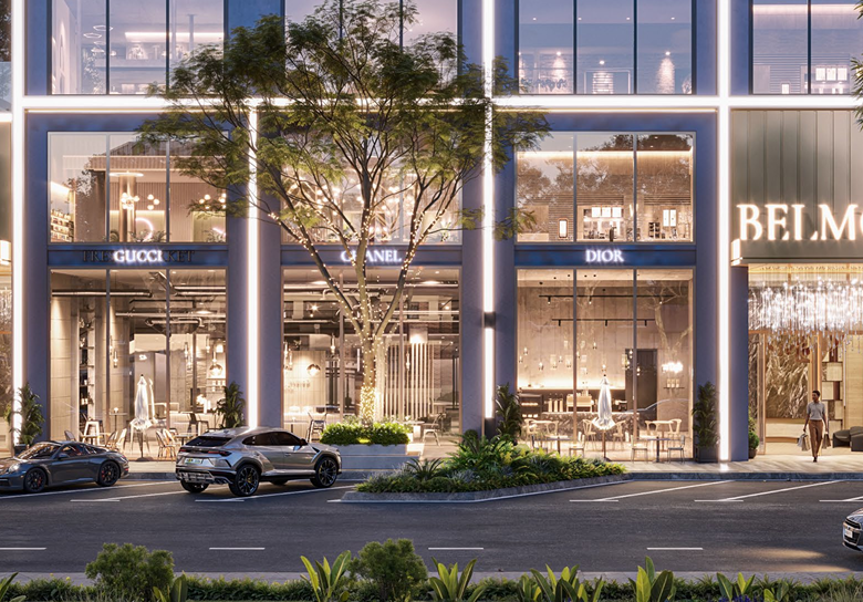 Belmont Residence Kilimani entrance rendering showing illuminated building signage, glass-fronted commercial spaces, landscaped frontage, modern architecture, and street-level access.