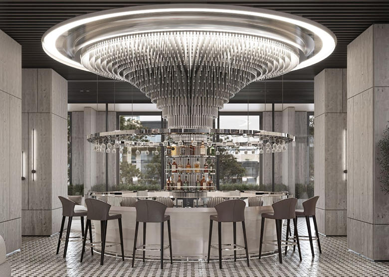 Belmont Residence residents' lounge rendering featuring an elegant circular bar, large chandelier, high stools, marble-effect walls, and comfortable communal seating.