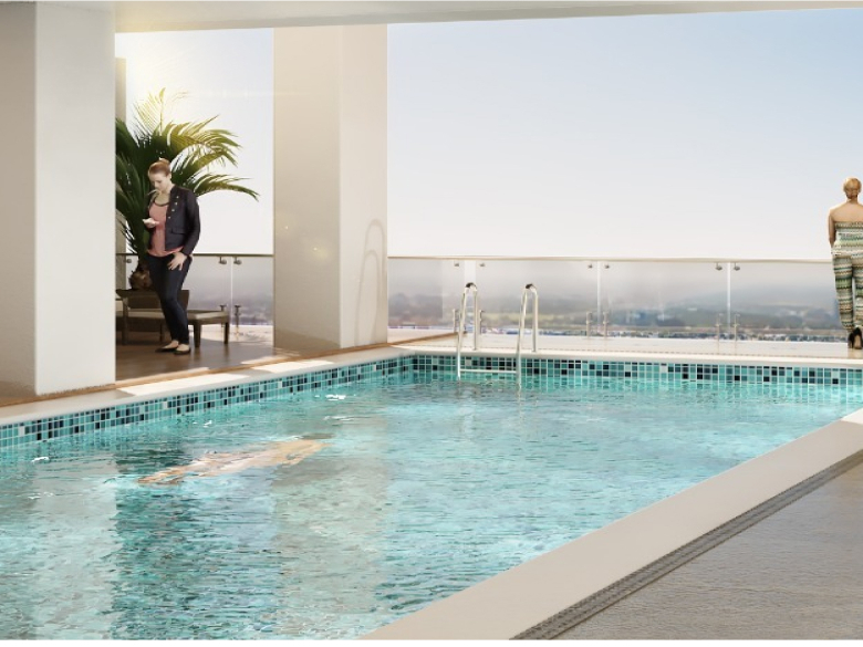Hayat Heights Kilimani swimming pool with poolside lounge chairs, glass balcony railings and beautiful panoramic city views.