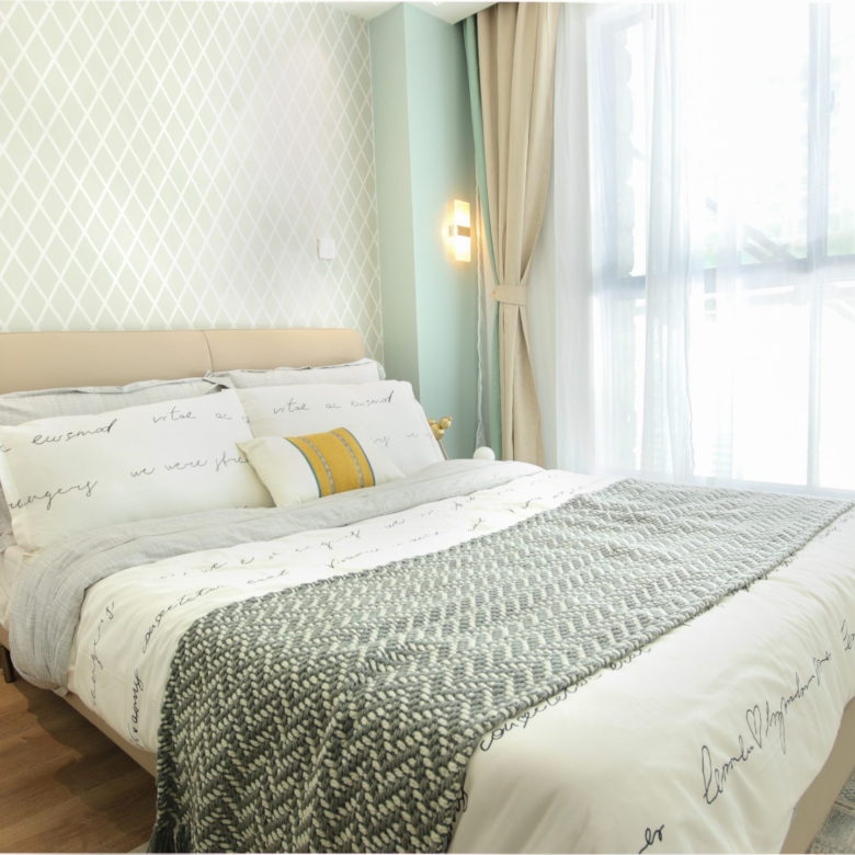 Himalaya Heights modern master bedroom with stylish furniture, elegant chandelier, decorative wallpaper and large windows in Kilimani.