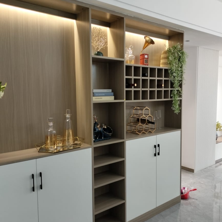 Himalaya Heights modern built-in storage cabinet with wooden shelving, decorative display spaces, wine rack and contemporary finishes.