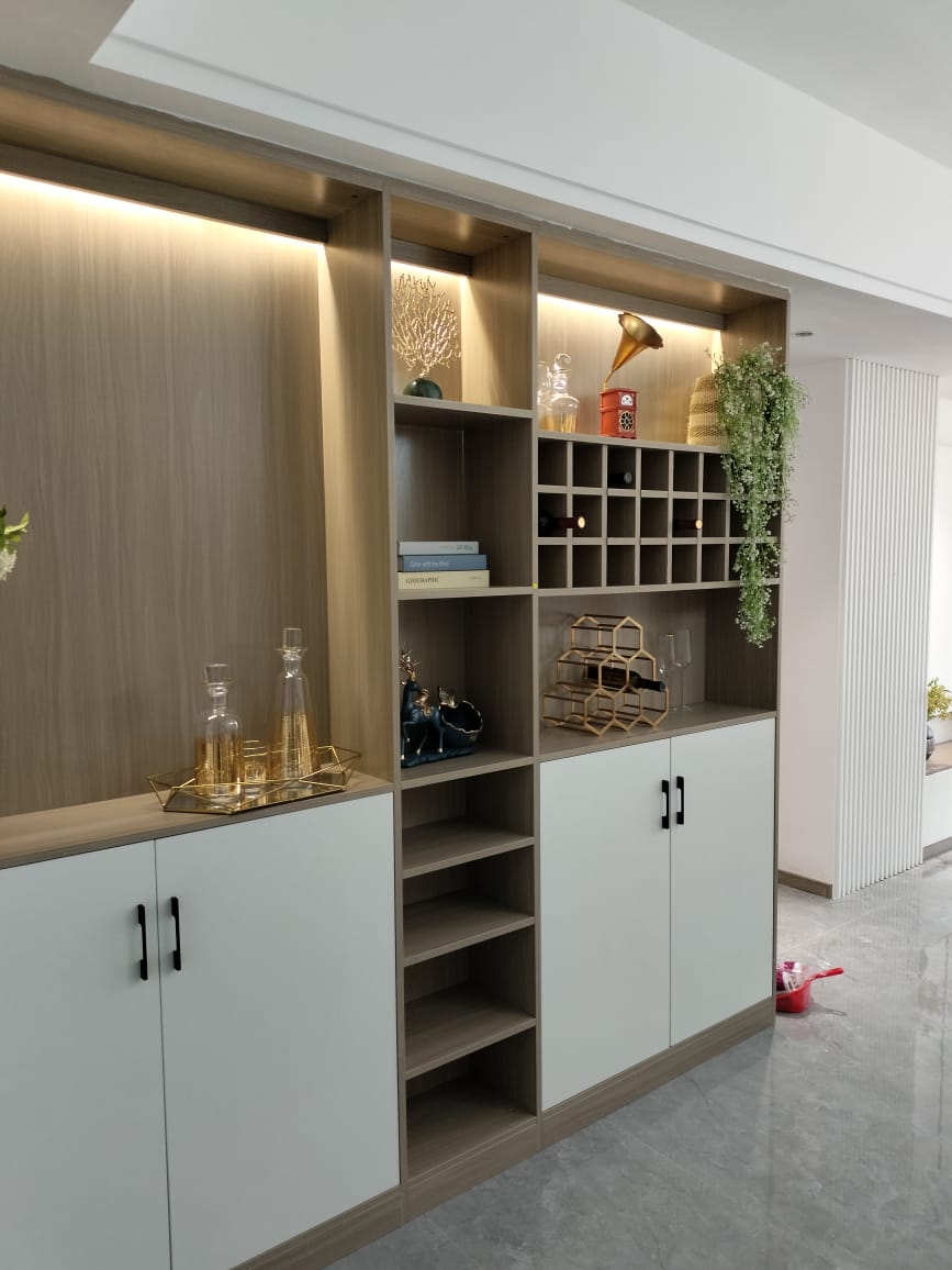 Himalaya Heights modern built-in storage cabinet with wooden shelving, decorative display spaces, wine rack and contemporary finishes.
