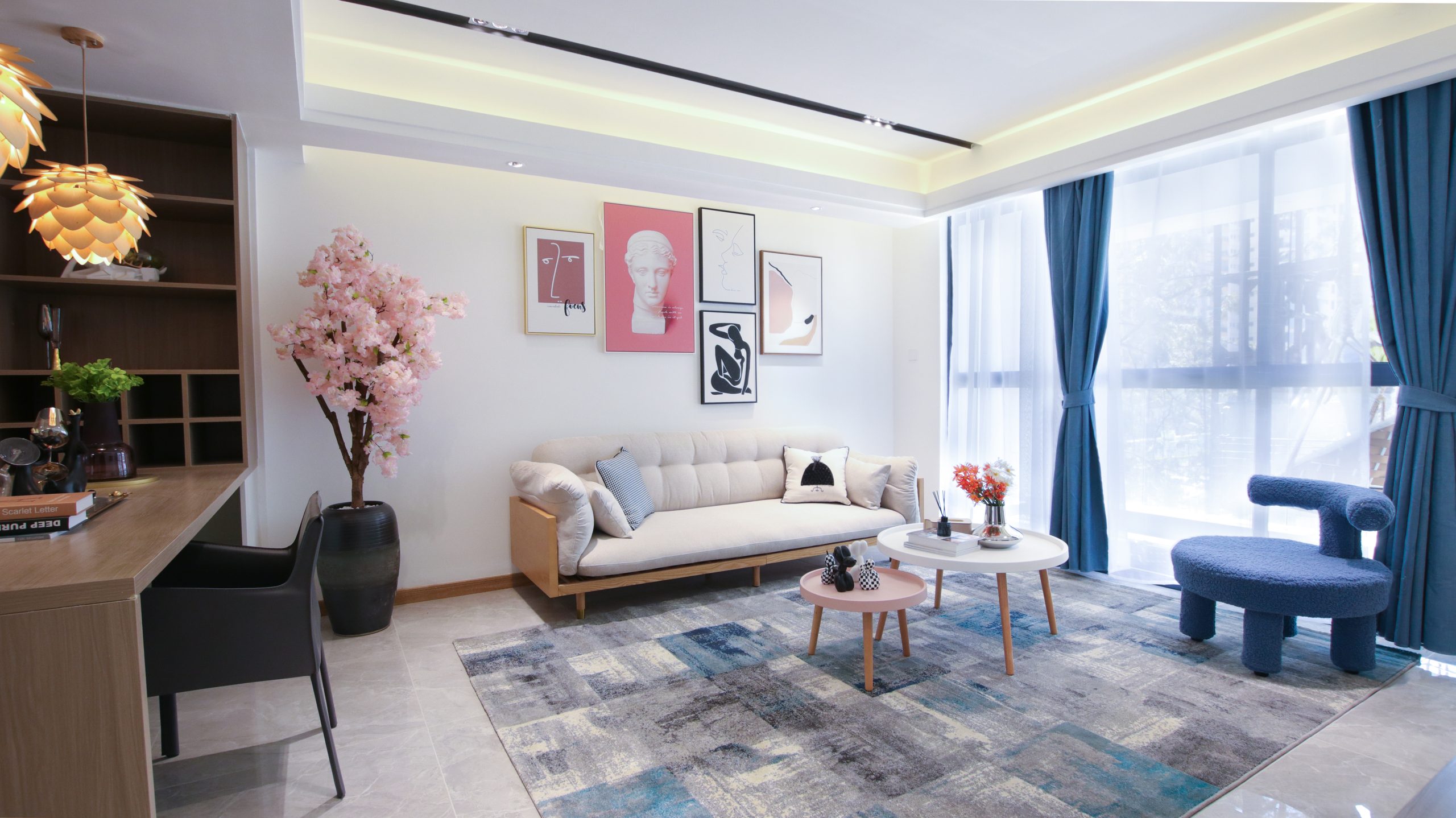 Himalaya Heights furnished living room with comfortable sofa, modern coffee tables, decorative wall art and large windows in Kilimani.