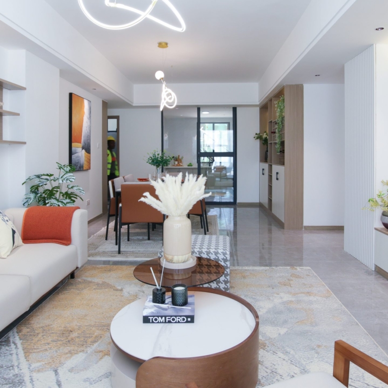Himalaya Heights contemporary open-plan apartment interior featuring a modern kitchen, dining counter, elegant living room and stylish furniture.