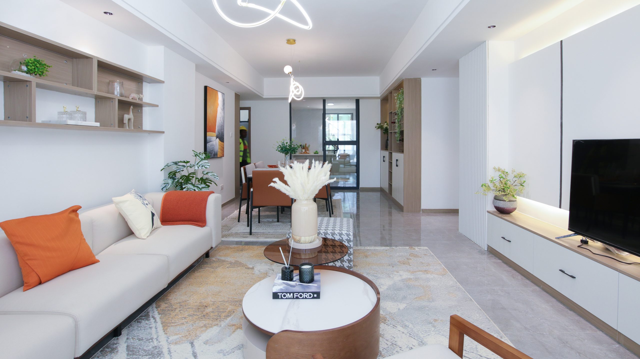 Himalaya Heights contemporary open-plan apartment interior featuring a modern kitchen, dining counter, elegant living room and stylish furniture.