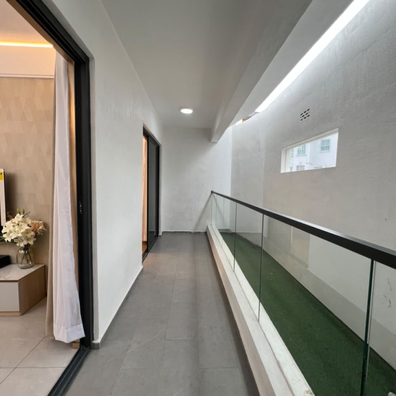 Longines Bay apartment balcony with glass railings and modern tiled flooring along Ngong Road, Nairobi.