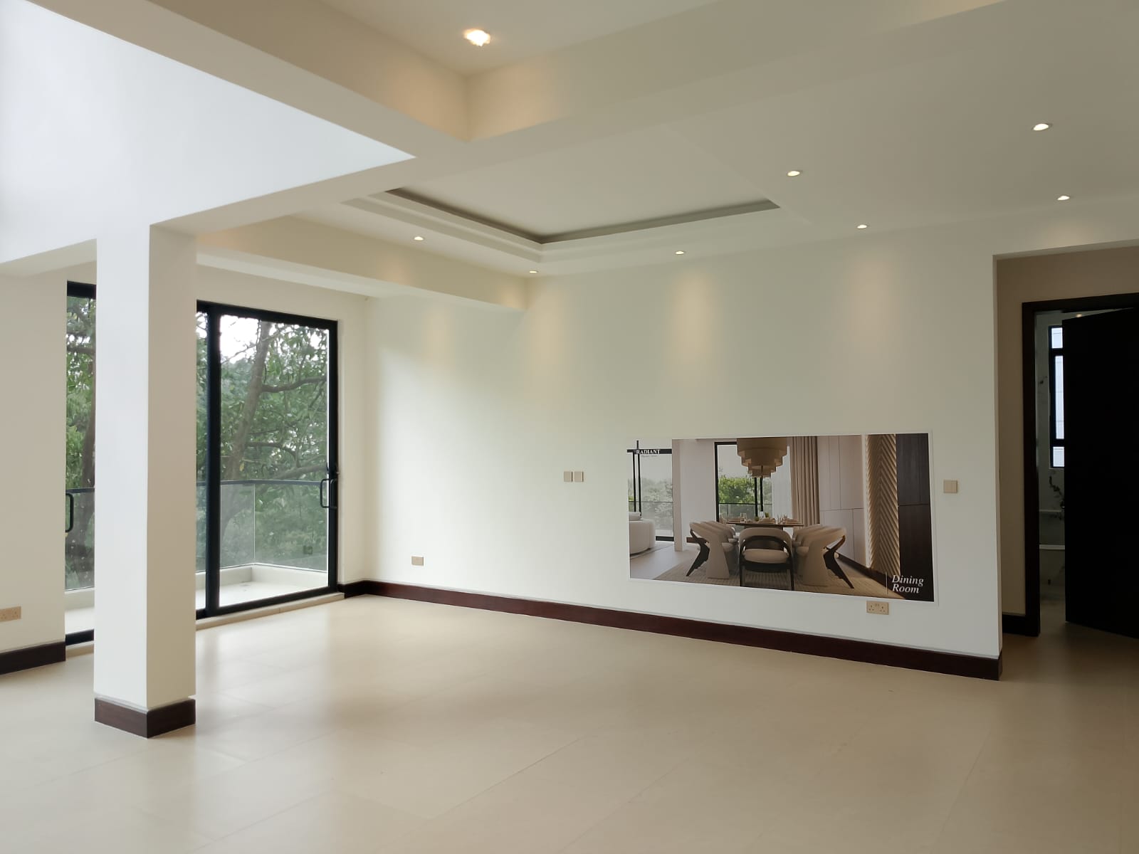 Radiant Villas spacious living and dining room in Westlands Nairobi with modern ceiling design and balcony access.