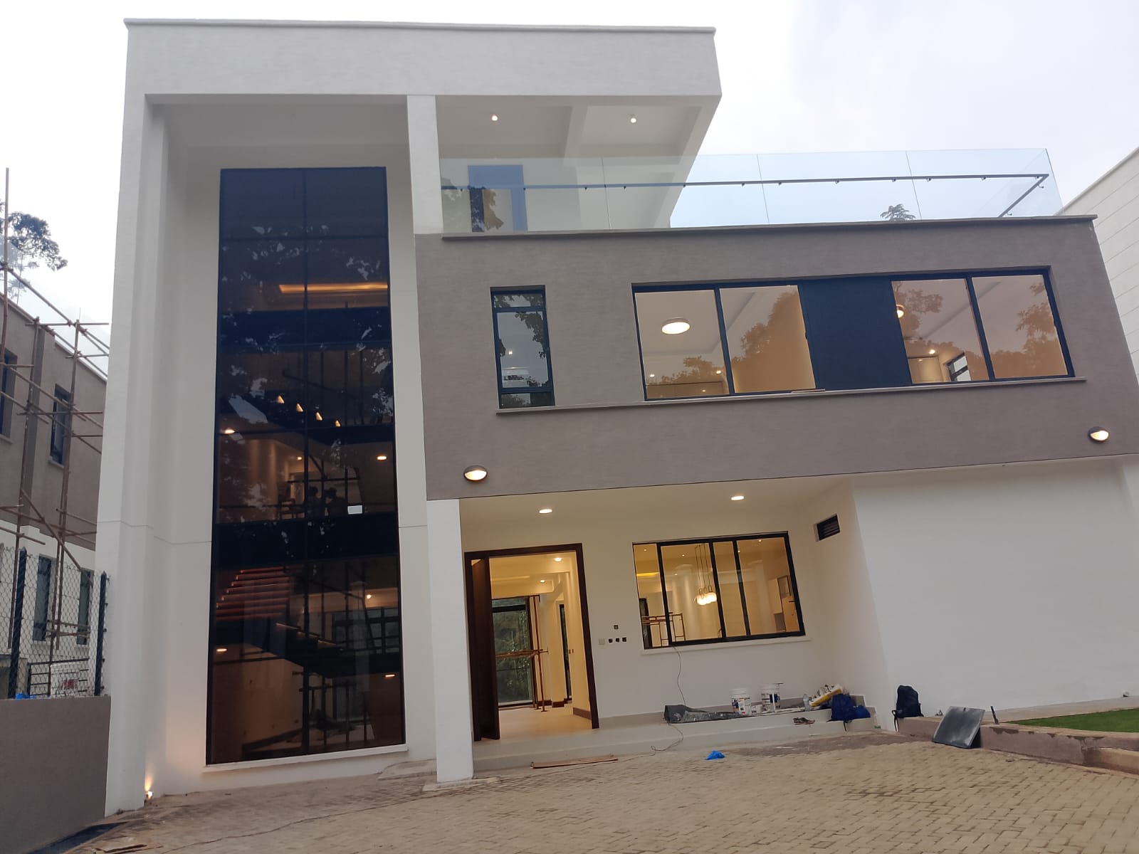 Radiant Villas luxury 6 bedroom house entrance in Westlands Nairobi featuring modern facade, large windows and private driveway.