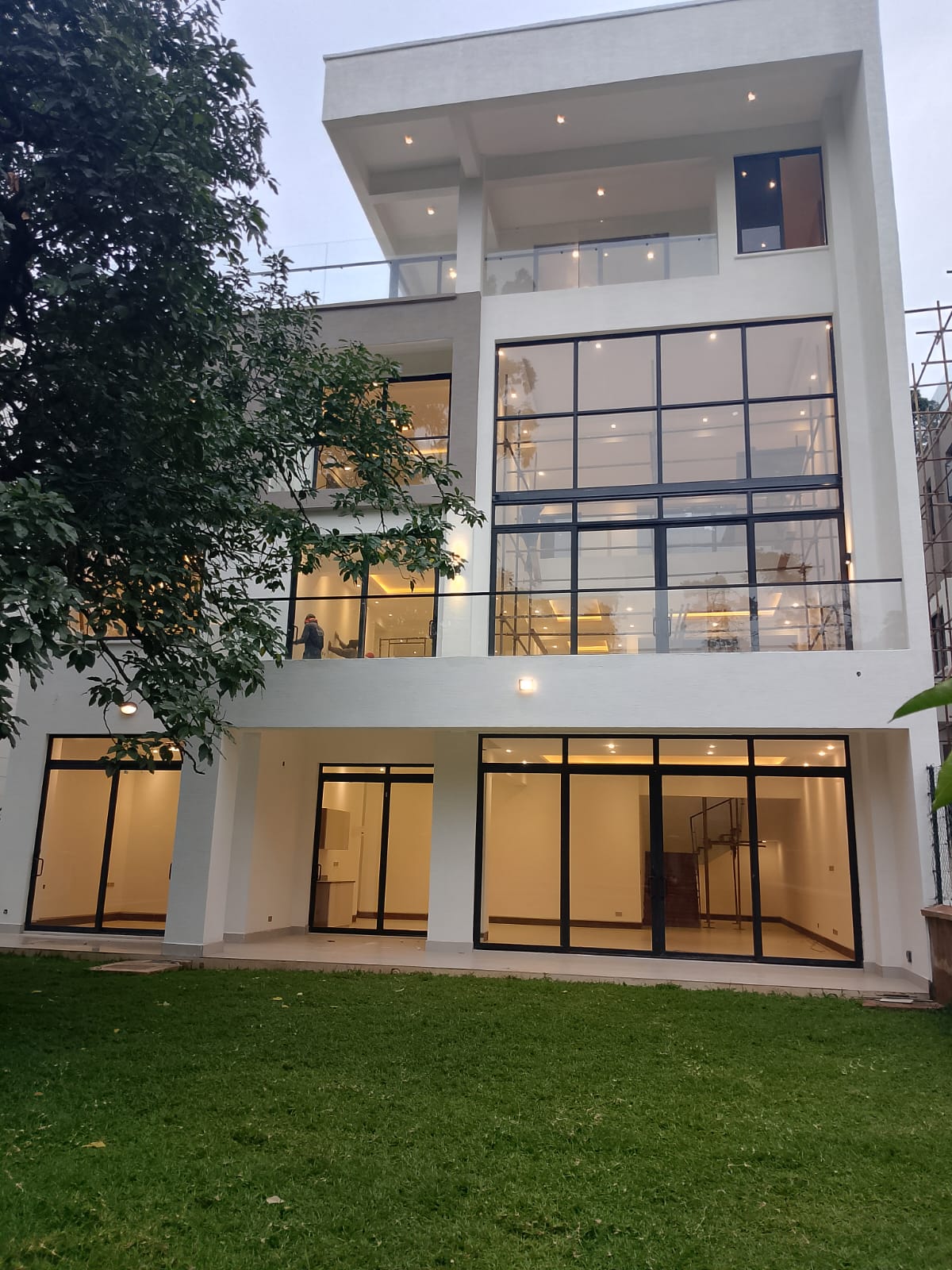 Radiant-Villas-exterior Radiant Villas luxury 6 bedroom villa exterior in Westlands Nairobi featuring large glass windows, balconies and private garden.