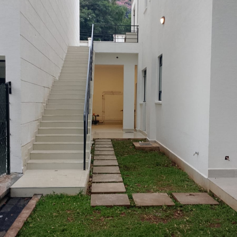 Radiant Villas exterior pathway in Westlands Nairobi featuring private garden, paved walkway and outdoor staircase.