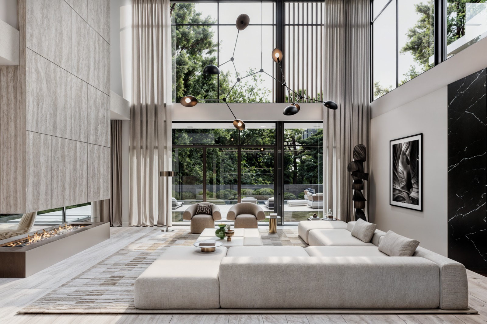 Leroux Villas double-volume living room with floor-to-ceiling windows and modern fireplace